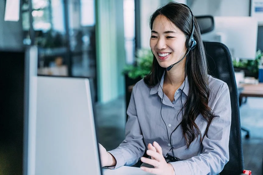 Customer service professional working at a workstation